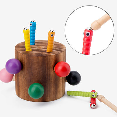 Hölzerner Fang das Wurm-Spiel für Augen-Koordinations-Training der Kinder Hand