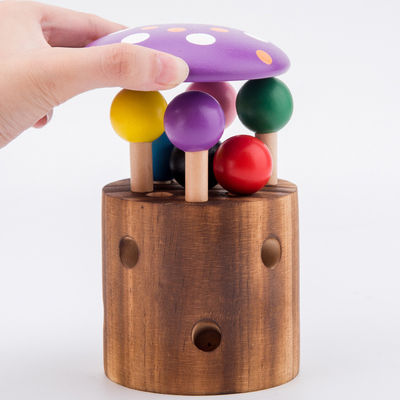 Hölzerner Fang das Wurm-Spiel für Augen-Koordinations-Training der Kinder Hand